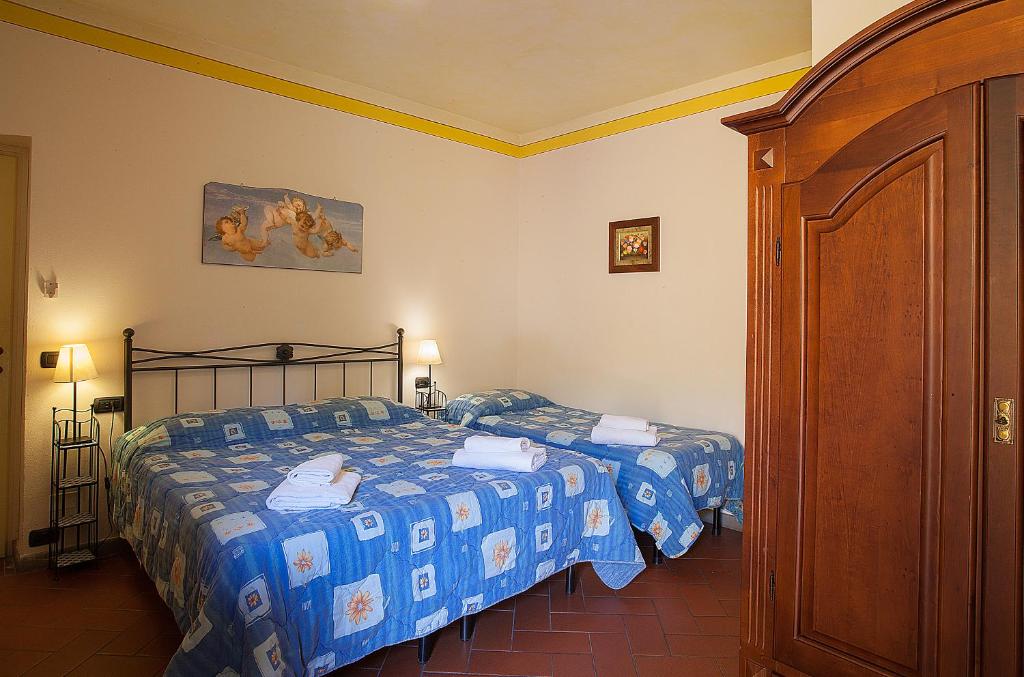 Postel nebo postele na pokoji v ubytování Il Casolare Di Leonardo