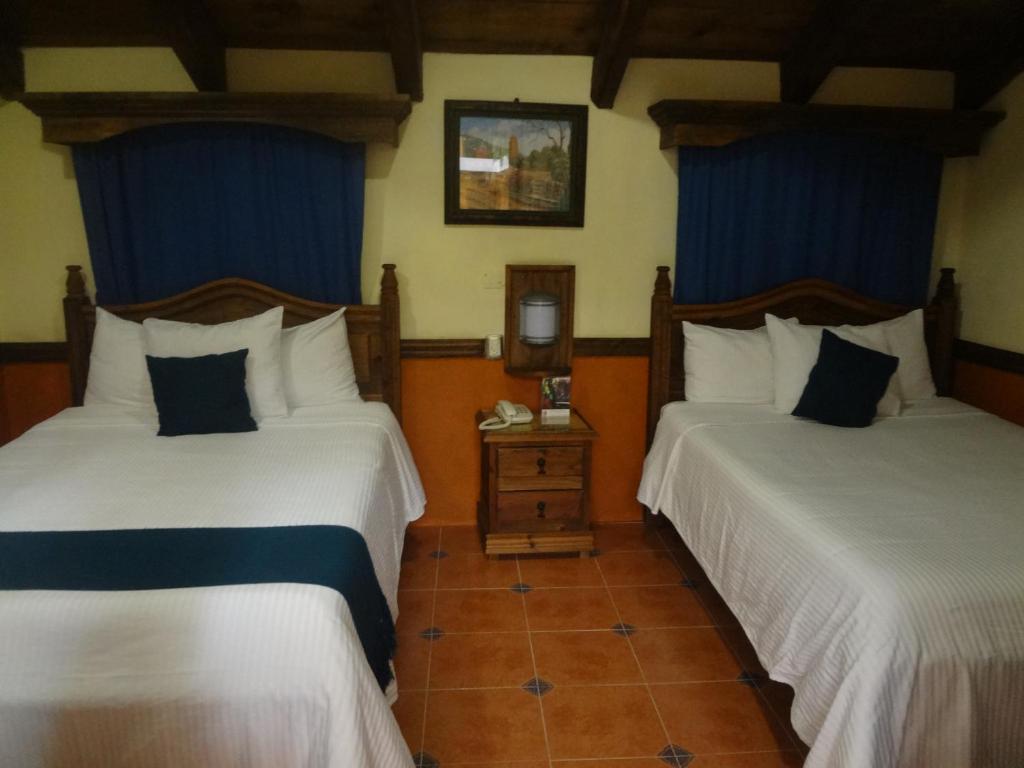 Postel nebo postele na pokoji v ubytování Hotel Tradicional