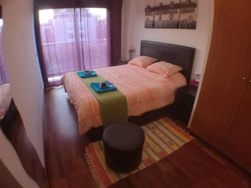 Posteľ alebo postele v izbe v ubytovaní Jie Apartment