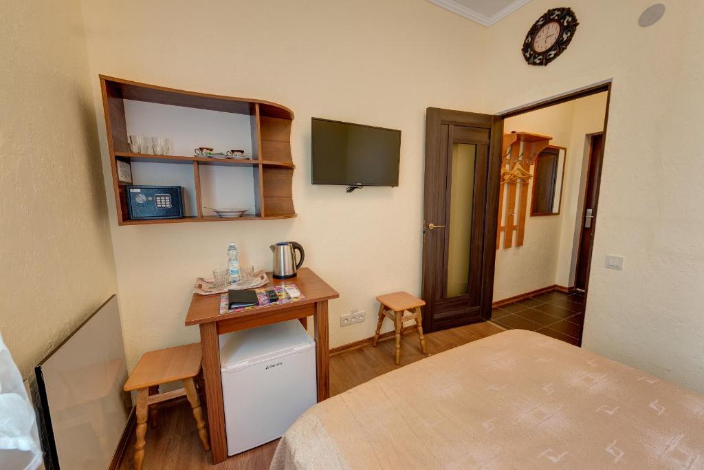 Postel nebo postele na pokoji v ubytování Aleksandria Hotel