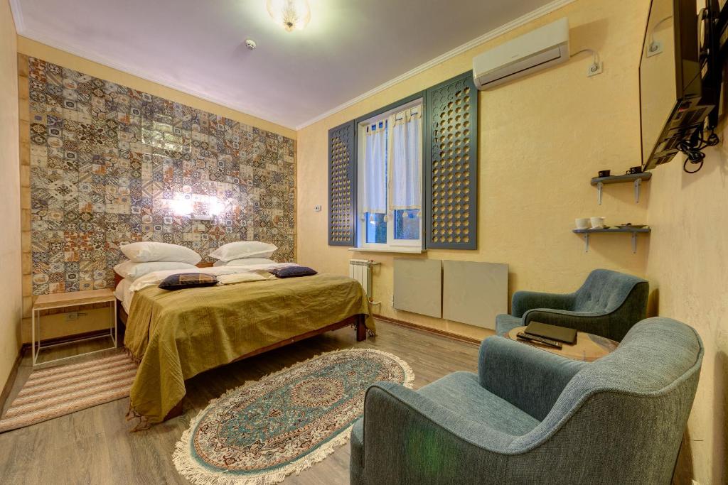 Postel nebo postele na pokoji v ubytování Aleksandria Hotel