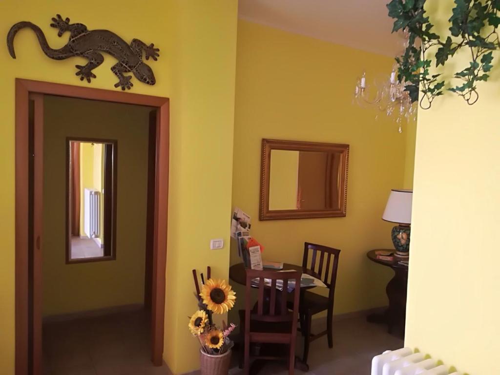 a dining room with a dinosaur on the wall at Locanda del Golfo in La Spezia