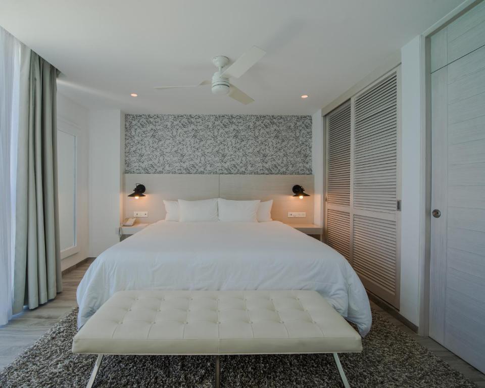 Postel nebo postele na pokoji v ubytování Oleo Cancun Playa All Inclusive Resort