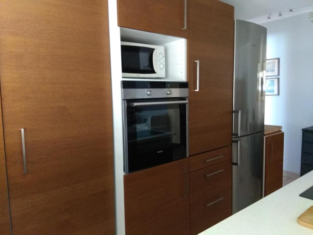 Kuchyň nebo kuchyňský kout v ubytování Apartamento