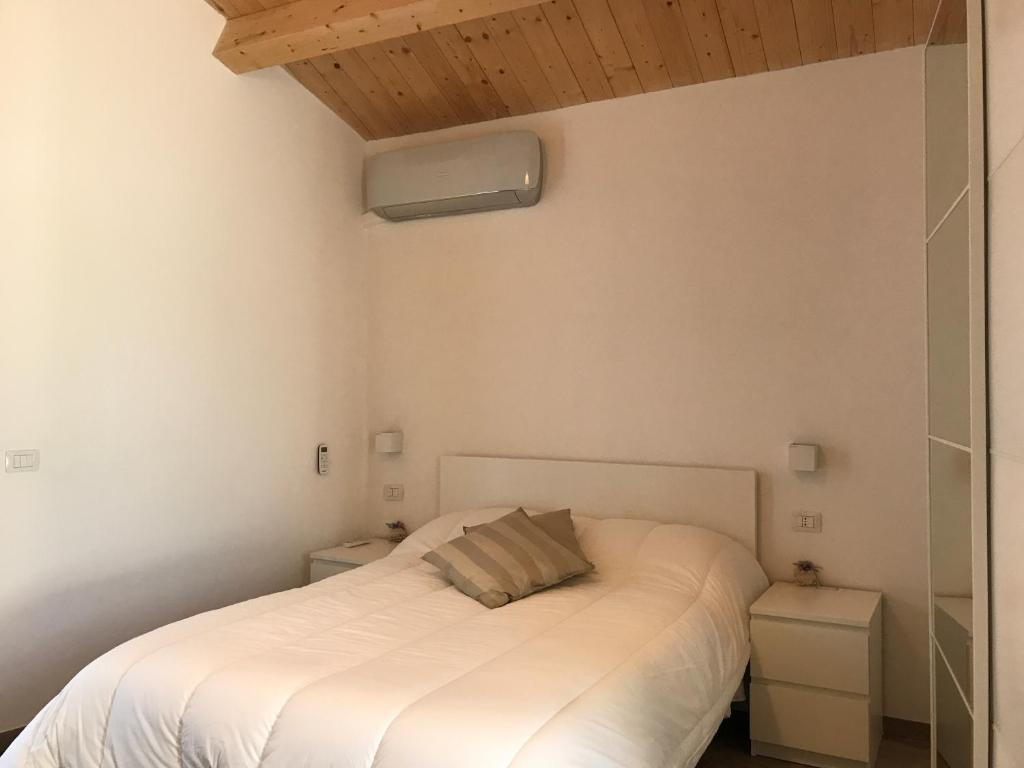 Ένα ή περισσότερα κρεβάτια σε δωμάτιο στο Affittacamere Al Civico 18