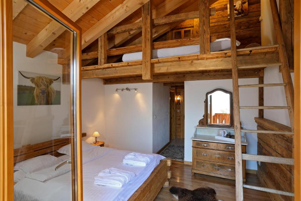 Postel nebo postele na pokoji v ubytování Les chambres et Roulottes des Noisetiers