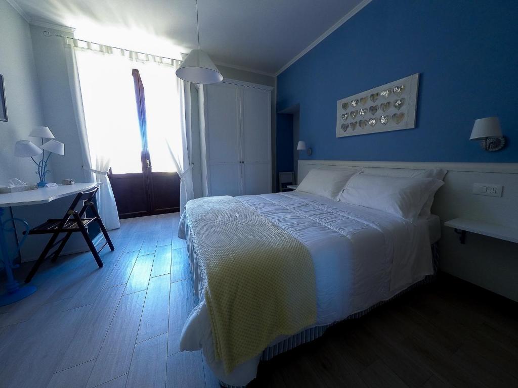 Postel nebo postele na pokoji v ubytování ReginElena B&B