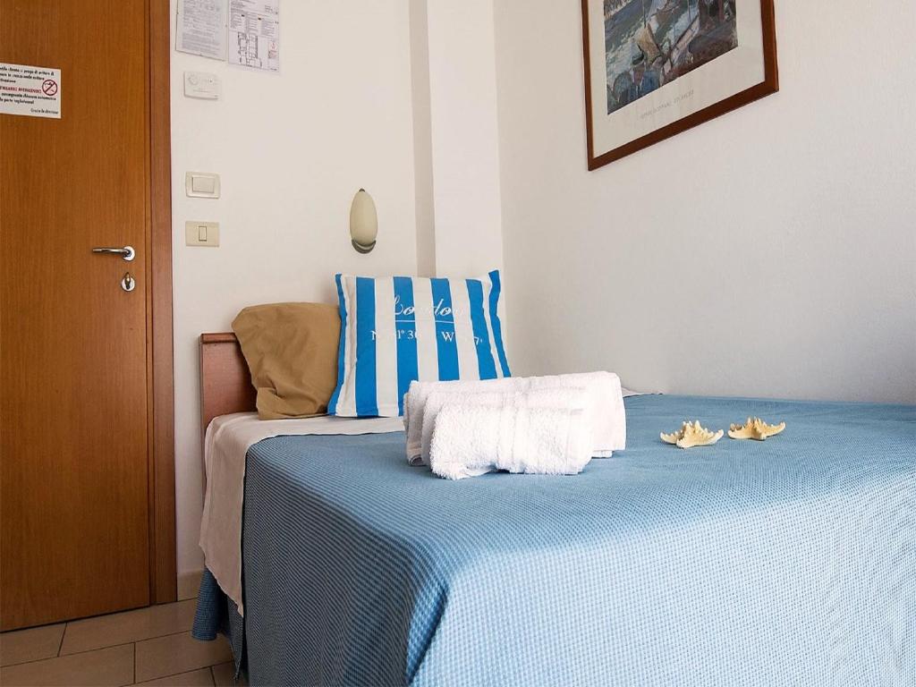 Postel nebo postele na pokoji v ubytování Hotel Taormina