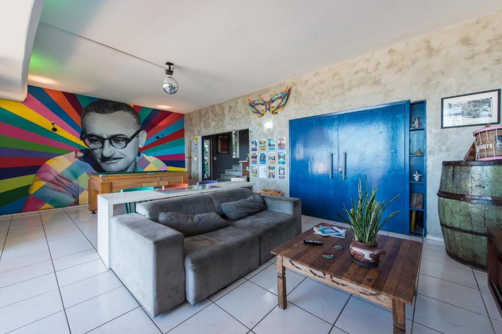 a living room with a couch and a table at Babilonia Rio Hostel in Rio de Janeiro