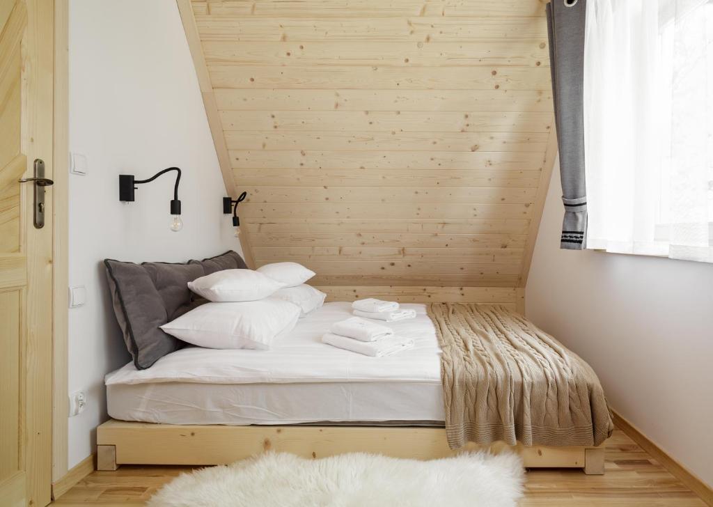 Posteľ alebo postele v izbe v ubytovaní Tatra Wood House