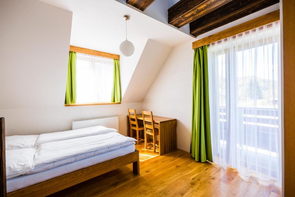 Postel nebo postele na pokoji v ubytování Penzion U Barana