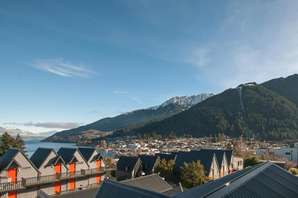 a view of a town with mountains in the background at Heartland Hotel Queenstown in Queenstown