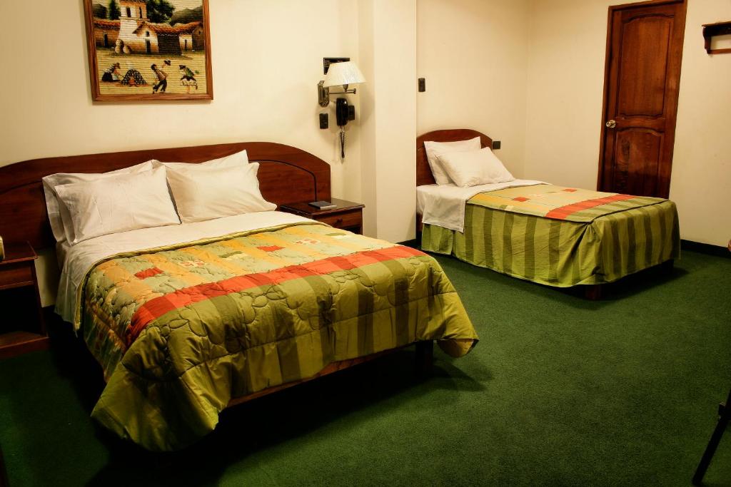 Letto o letti in una camera di Amara Hotel