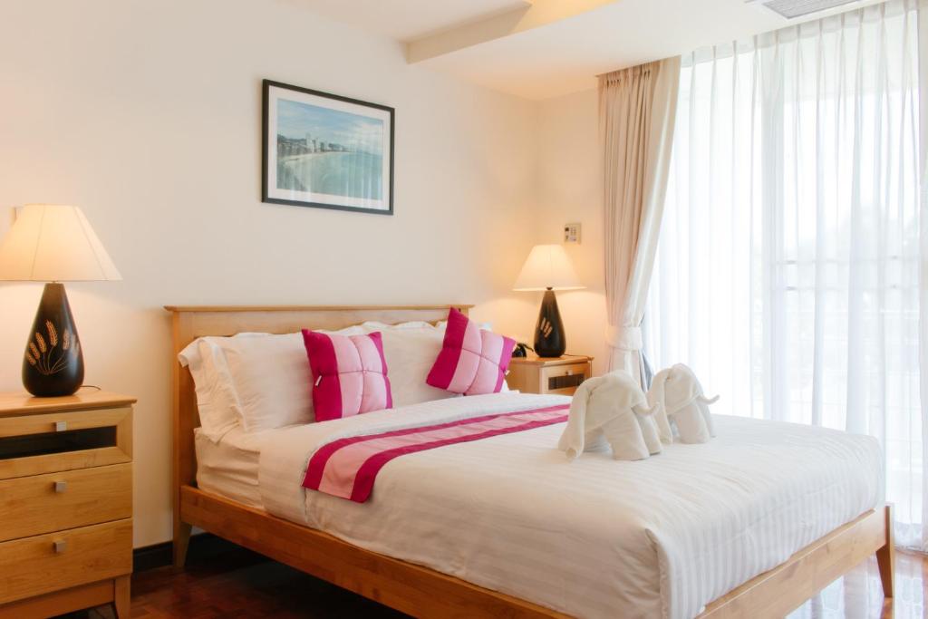 Postel nebo postele na pokoji v ubytování SeaRidge Hua Hin Resort & Poolvilla