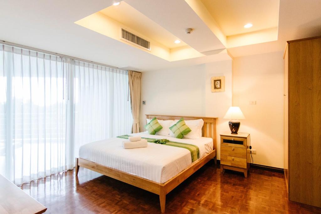 Postel nebo postele na pokoji v ubytování SeaRidge Hua Hin Resort & Poolvilla