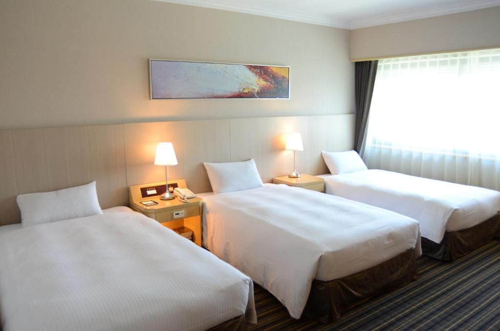 Postel nebo postele na pokoji v ubytování Santos Hotel