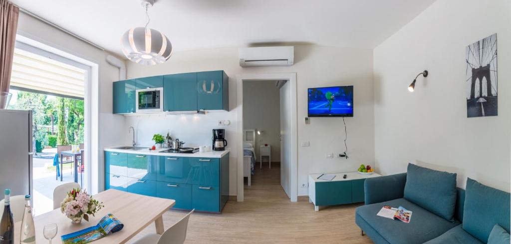 Kuchyň nebo kuchyňský kout v ubytování Camping Village Du Parc