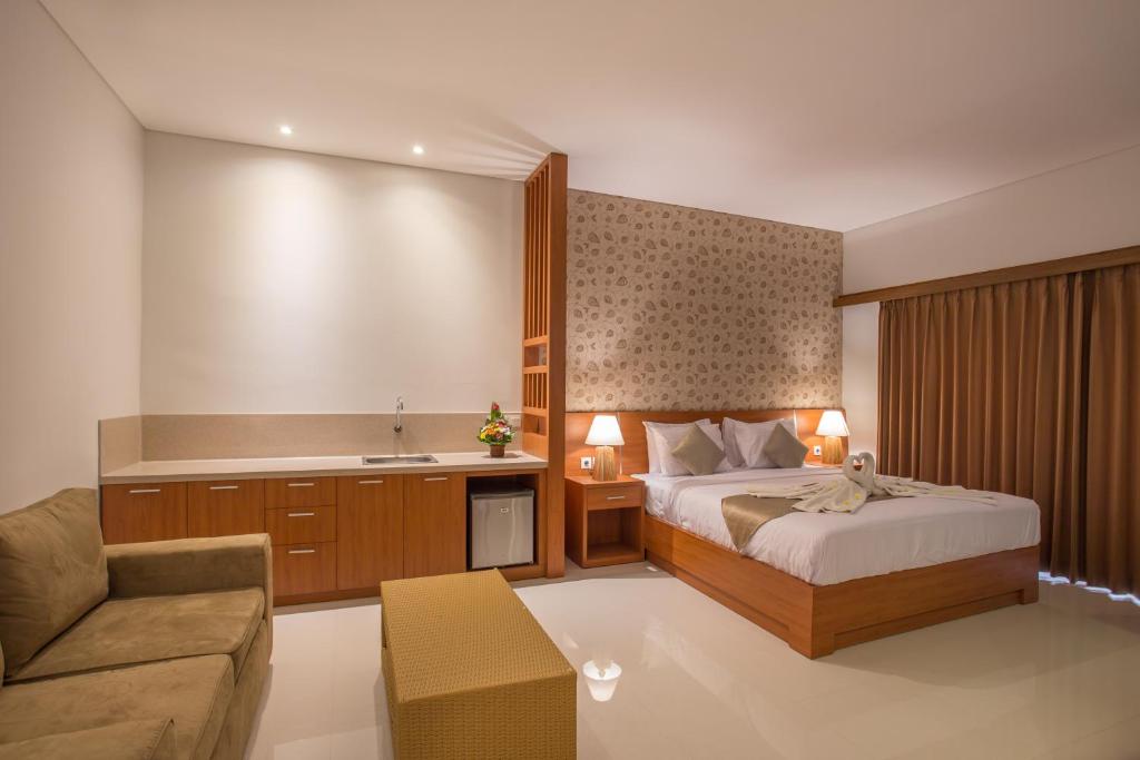 Postel nebo postele na pokoji v ubytování Grand Sehati & Spa, Ubud