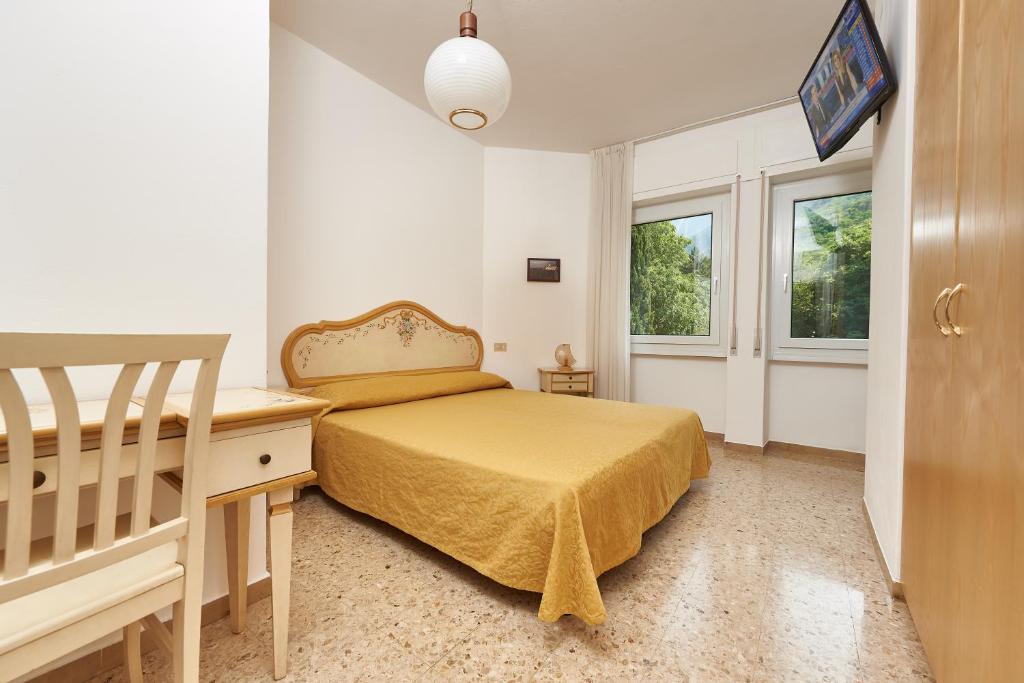 Postel nebo postele na pokoji v ubytování Hotel Villa Orizzonte