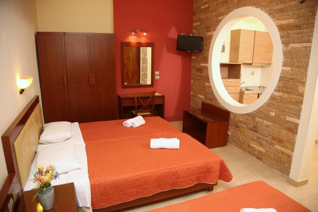 Postel nebo postele na pokoji v ubytování Hotel Zeus