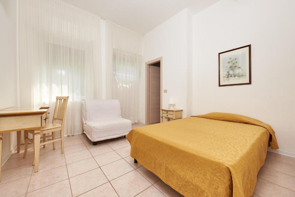 Postel nebo postele na pokoji v ubytování Hotel Villa Orizzonte