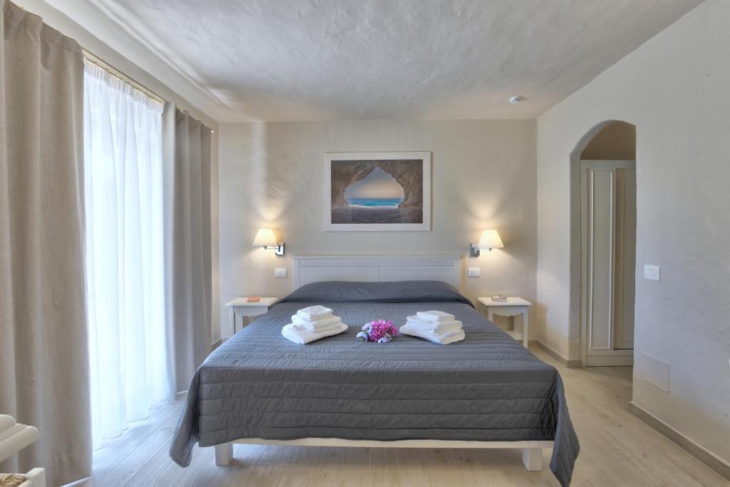 Postel nebo postele na pokoji v ubytování Hotel Nibaru