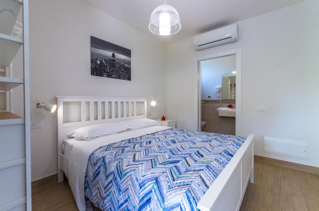 Postel nebo postele na pokoji v ubytování Camping Village Du Parc
