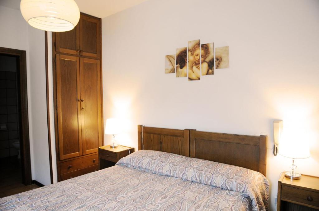Postel nebo postele na pokoji v ubytování Hotel Eternità