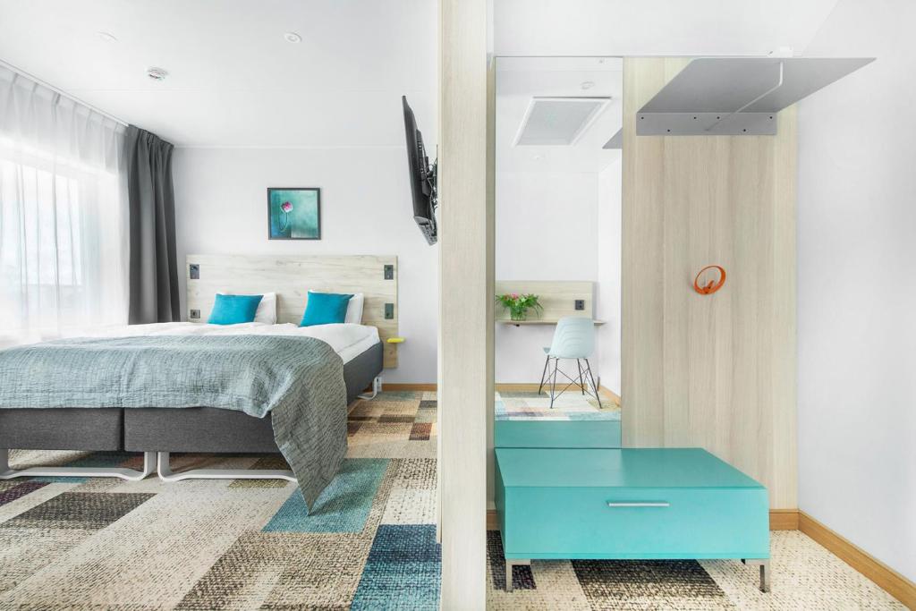 Postel nebo postele na pokoji v ubytování ArenaHotellet i Uppsala