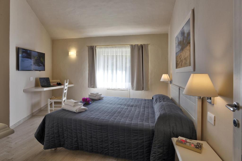 Postel nebo postele na pokoji v ubytování Hotel Nibaru