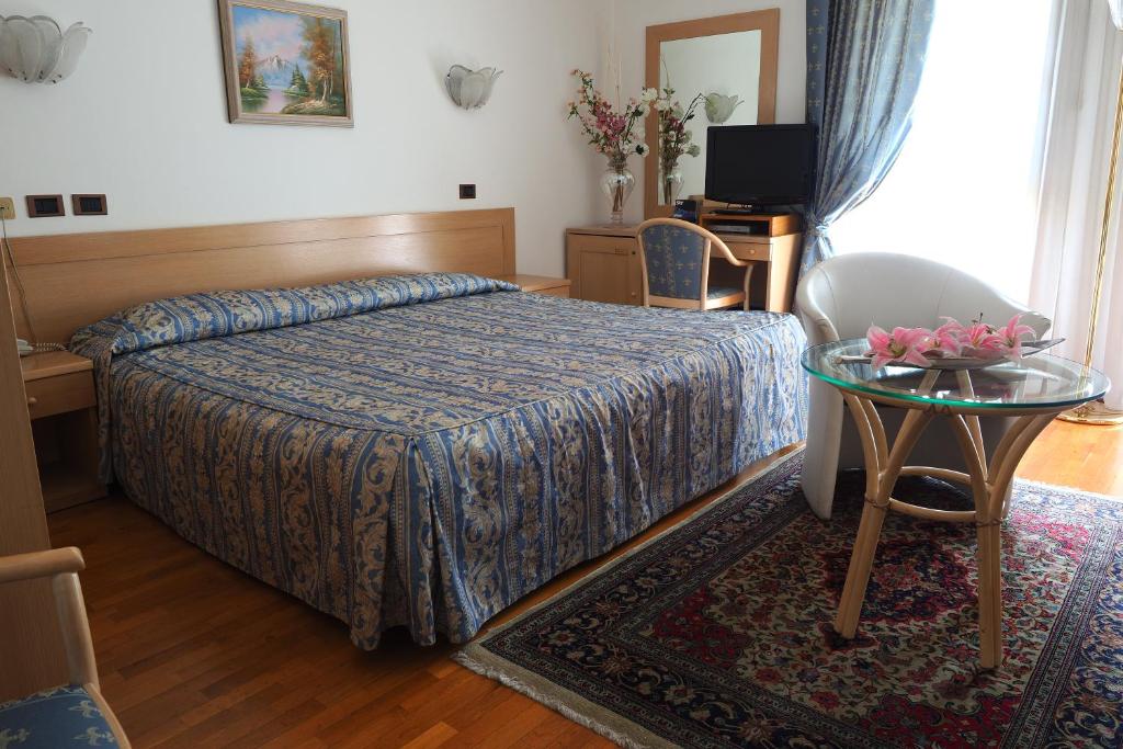 Postel nebo postele na pokoji v ubytování Hotel Spresiano