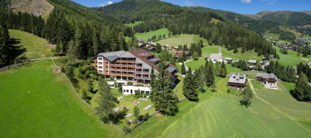 an aerial view of a resort in the mountains at Hotel St. Oswald in Bad Kleinkirchheim