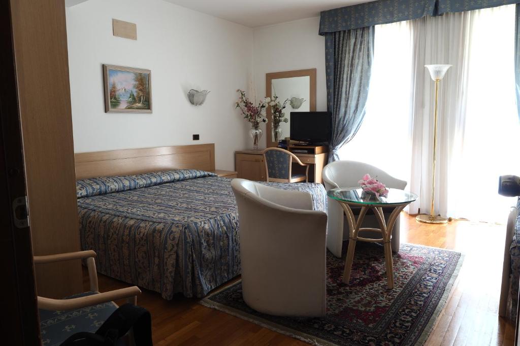 Postel nebo postele na pokoji v ubytování Hotel Spresiano