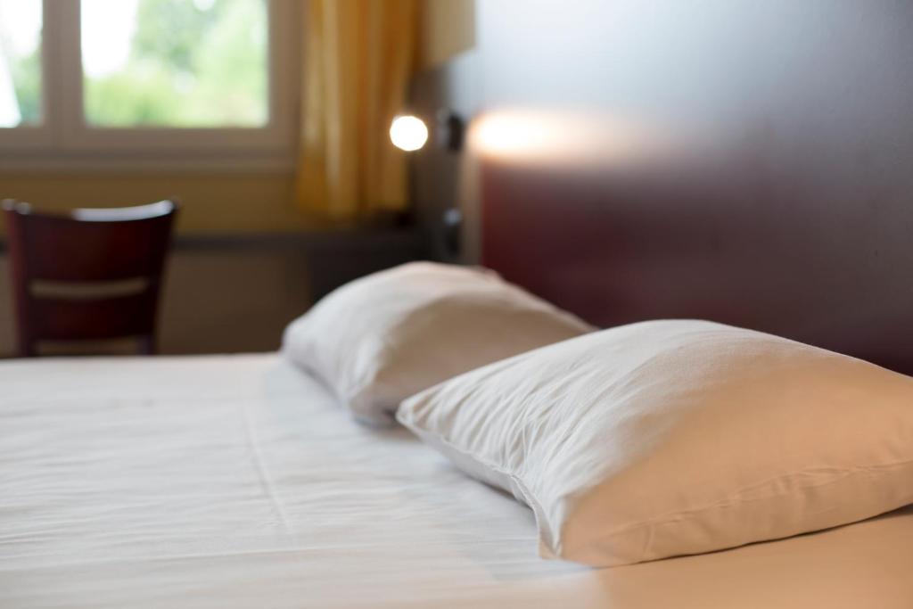 Postel nebo postele na pokoji v ubytování Mape hôtel