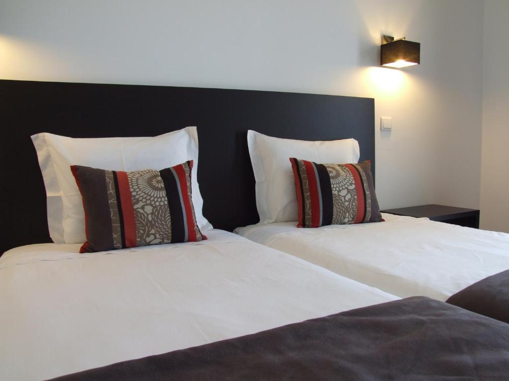 En eller flere senge i et værelse på Casa Do Vale Hotel