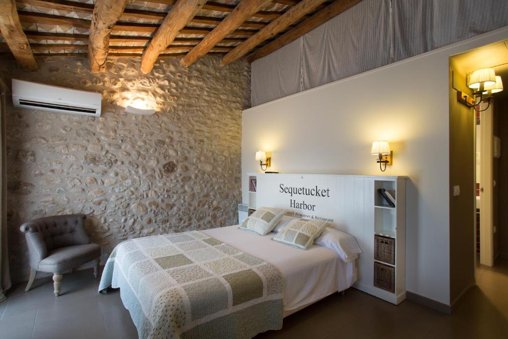 Postel nebo postele na pokoji v ubytování Can Clotas Hotel Masia