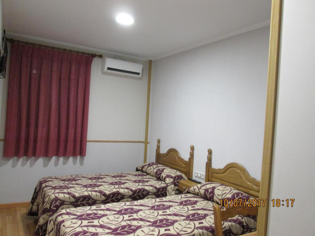 Posteľ alebo postele v izbe v ubytovaní Hostal Banderas