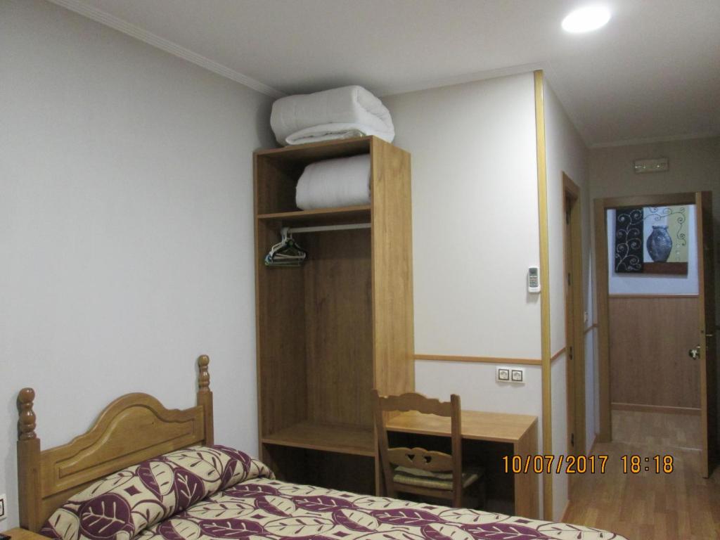 Posteľ alebo postele v izbe v ubytovaní Hostal Banderas