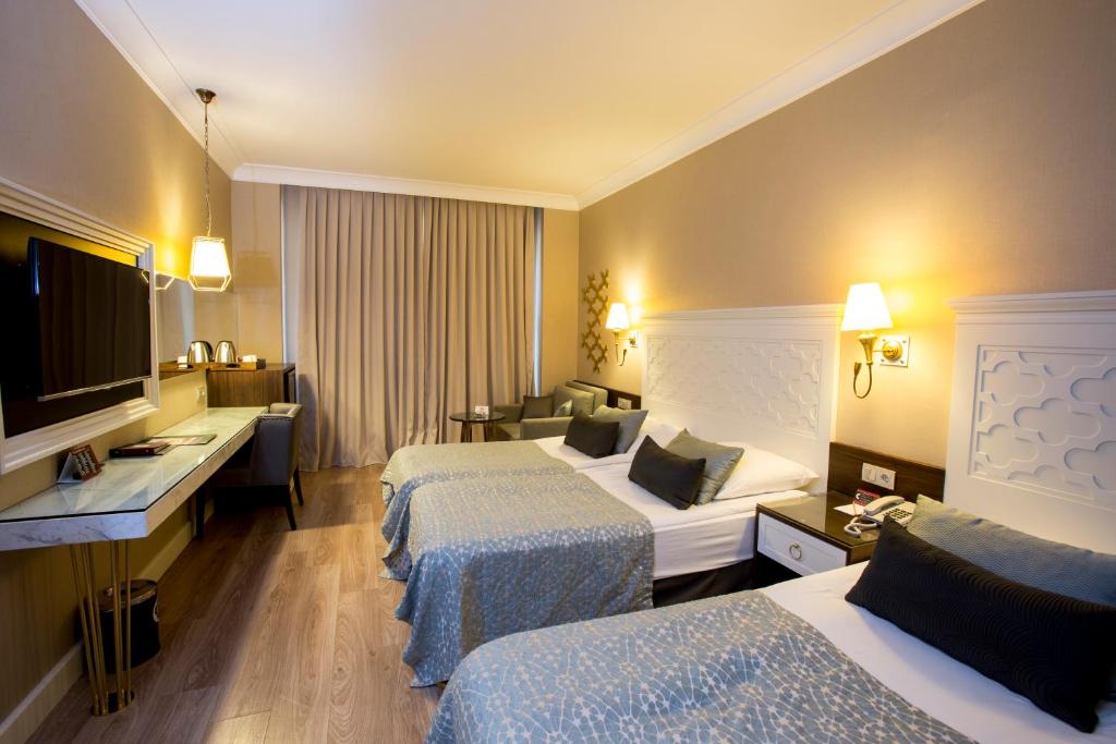 TV a/nebo společenská místnost v ubytování Fame Residence Kemer & Spa