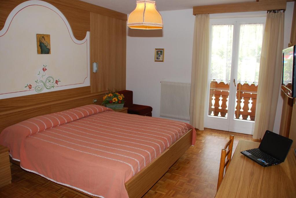 Postel nebo postele na pokoji v ubytování Charme Hotel Nevada