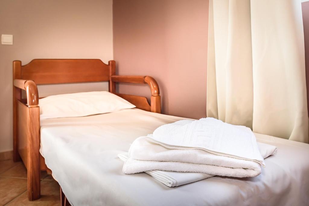 Postel nebo postele na pokoji v ubytování Irinoula Dreams