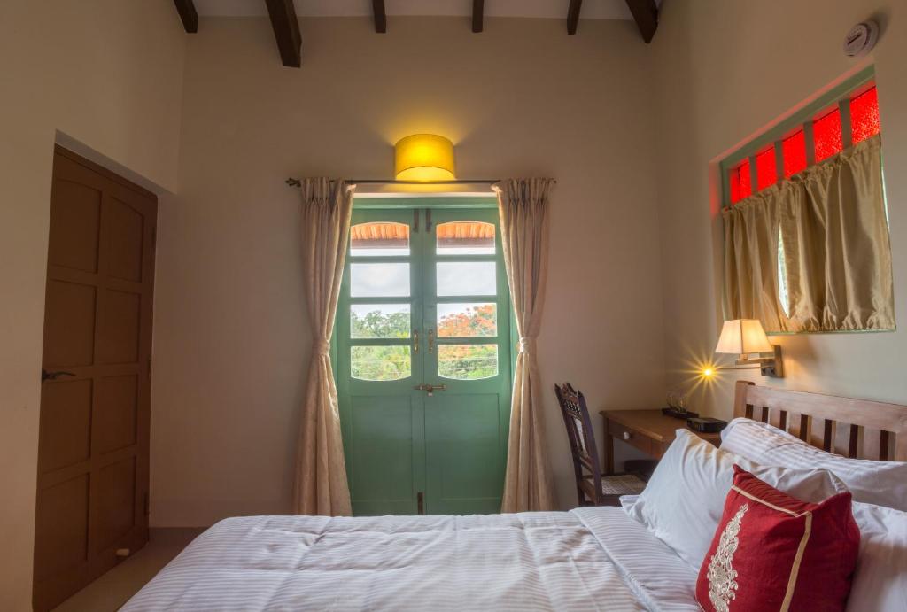 Postel nebo postele na pokoji v ubytování Lar Amorosa Boutique Hotel - Goa