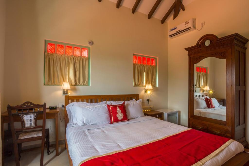 Postel nebo postele na pokoji v ubytování Lar Amorosa Boutique Hotel - Goa