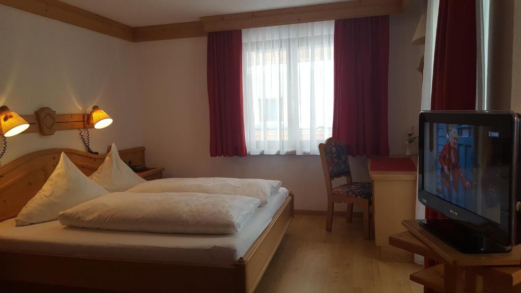 Postel nebo postele na pokoji v ubytování Hotel Camona & Apart Walserhof
