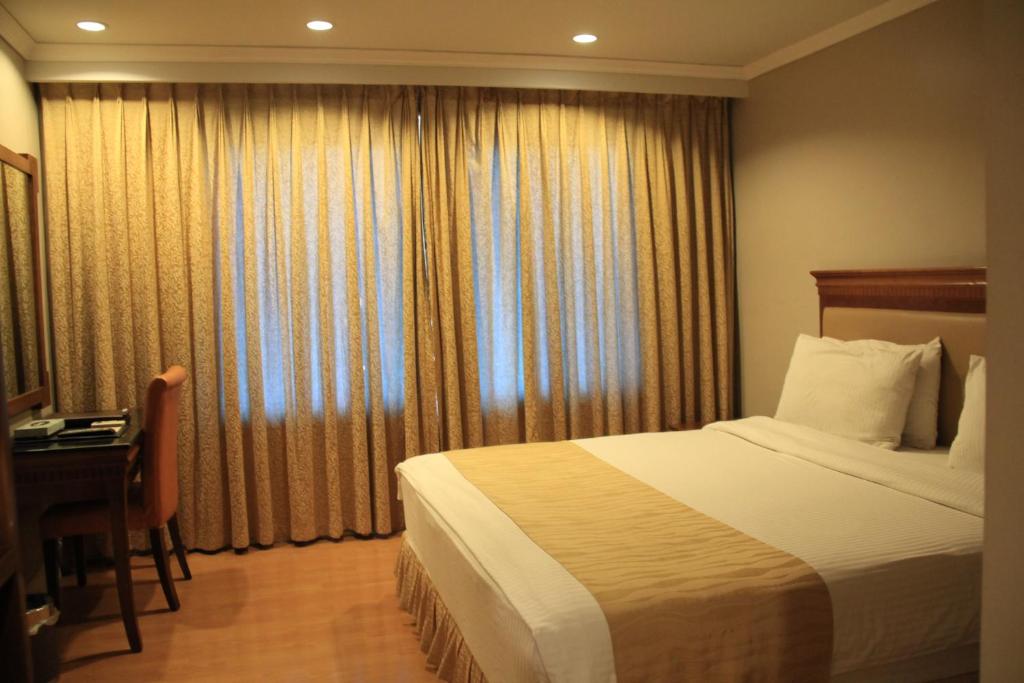Postel nebo postele na pokoji v ubytování Savannah Resort Hotel