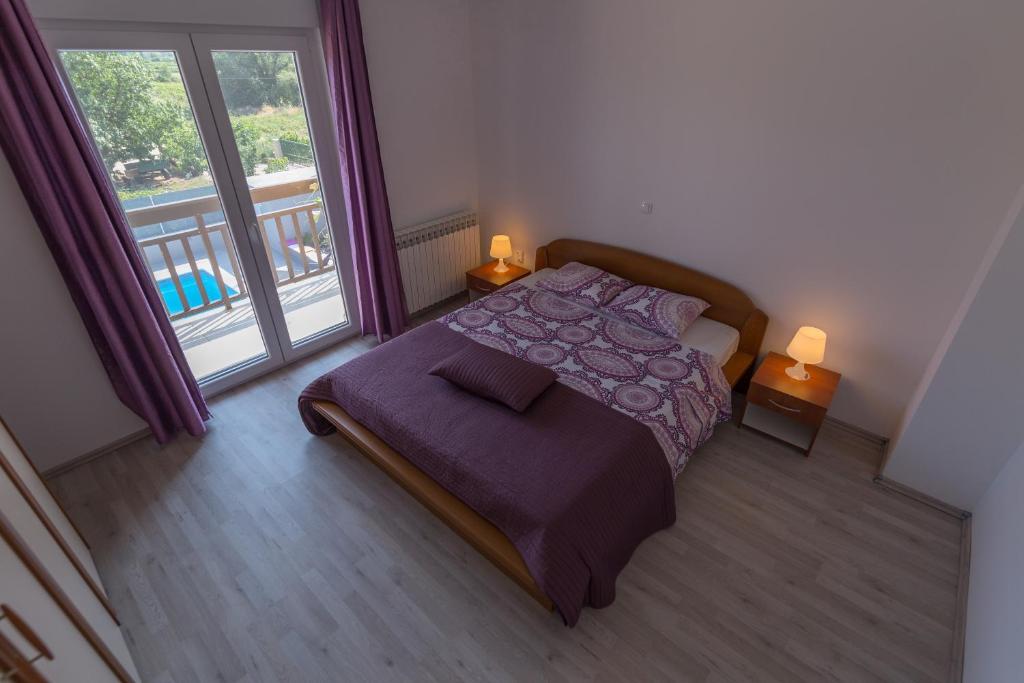 Postel nebo postele na pokoji v ubytování Villa Laura
