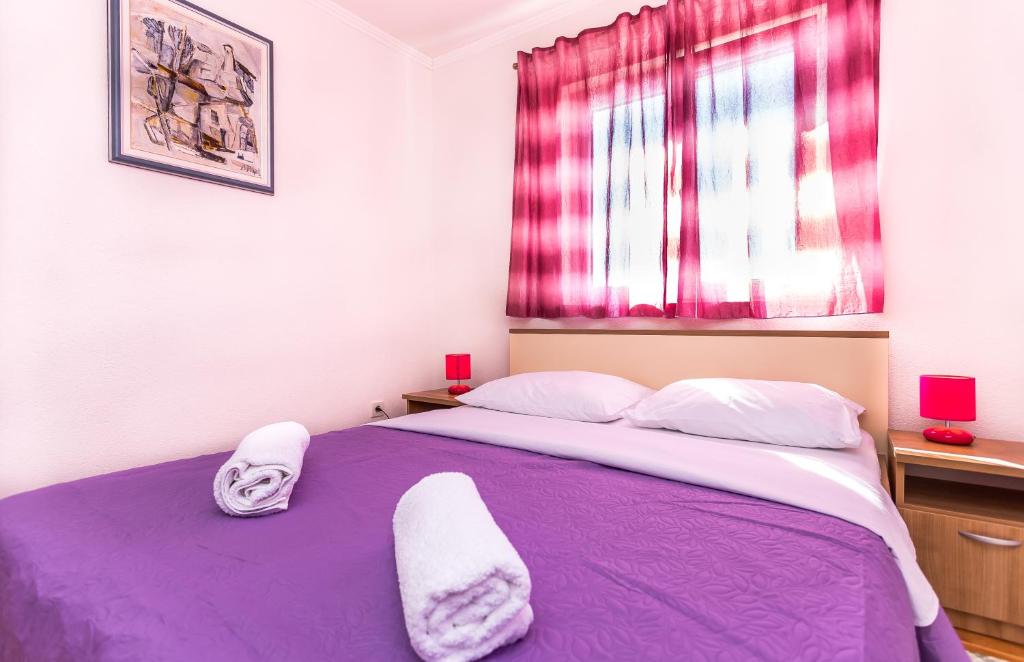 Posteľ alebo postele v izbe v ubytovaní Apartments Blaža