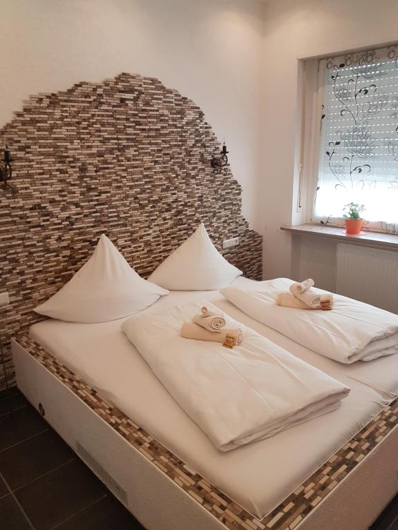 Postel nebo postele na pokoji v ubytování Hotel Schweizer Stubb