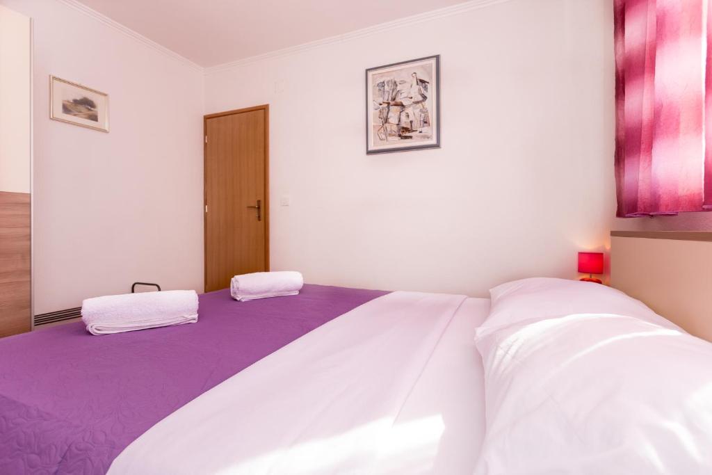 Posteľ alebo postele v izbe v ubytovaní Apartments Blaža