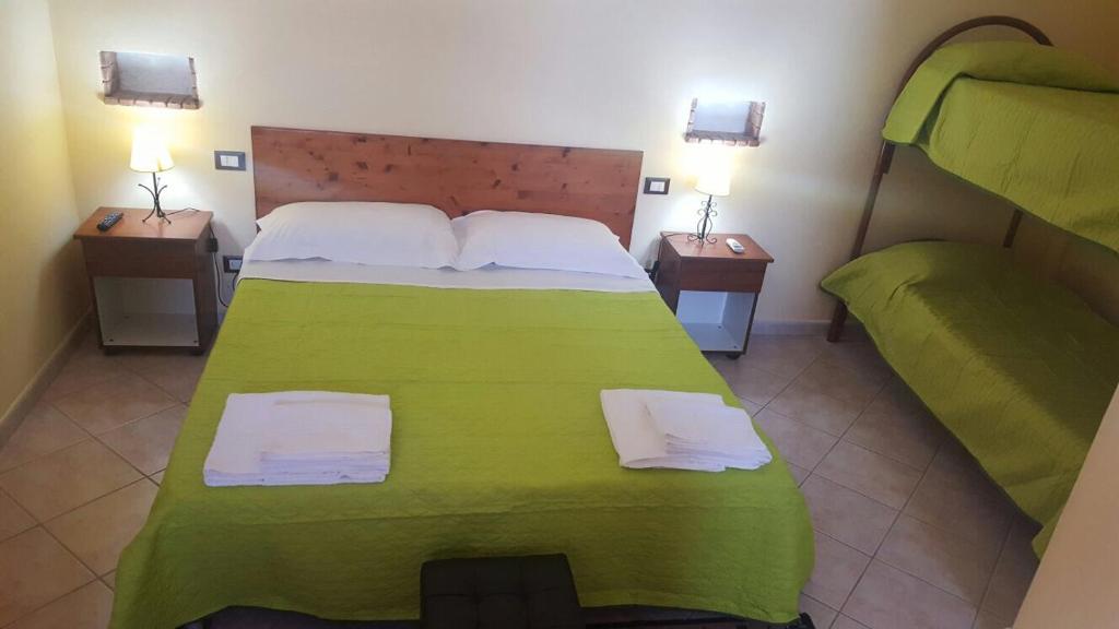 Postel nebo postele na pokoji v ubytování Camere Con Terrazzino